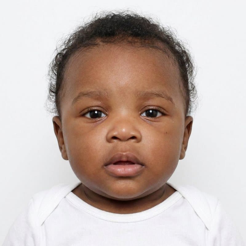 Passport-ready photo of the same baby