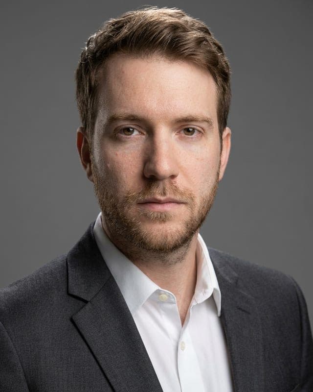 Professional headshot of the same person, generated by AI Passport Photo