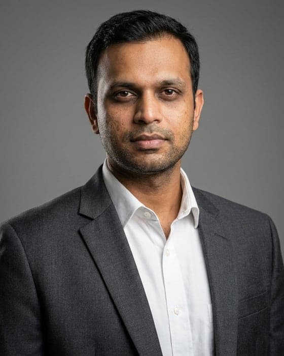 Professional headshot produced by AI Passport Photo from the phone photo shown inset